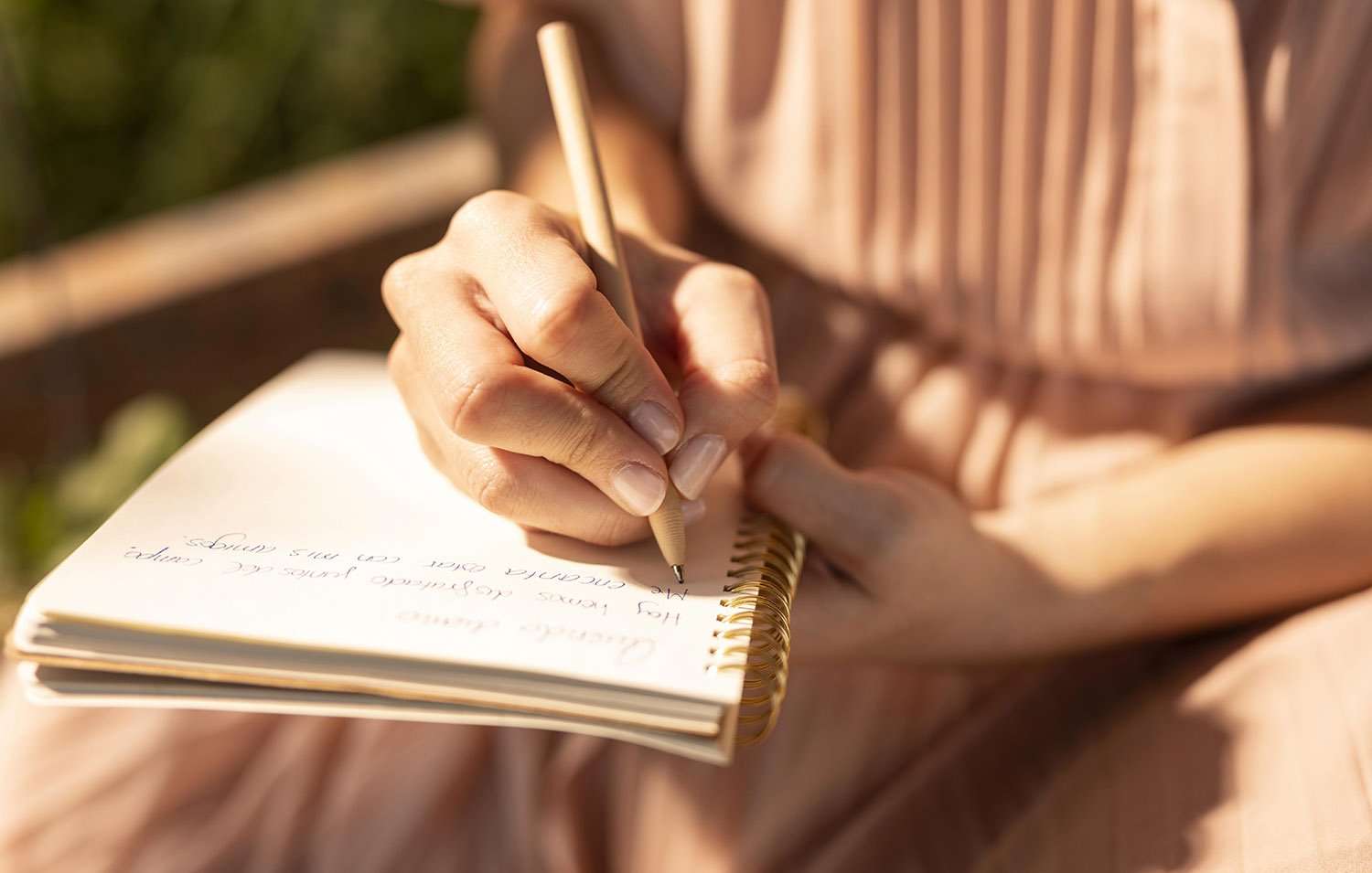 close-up-hand-writing-notebook